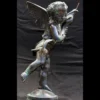 Scultura Putto con Delfino in Bronzo Verde